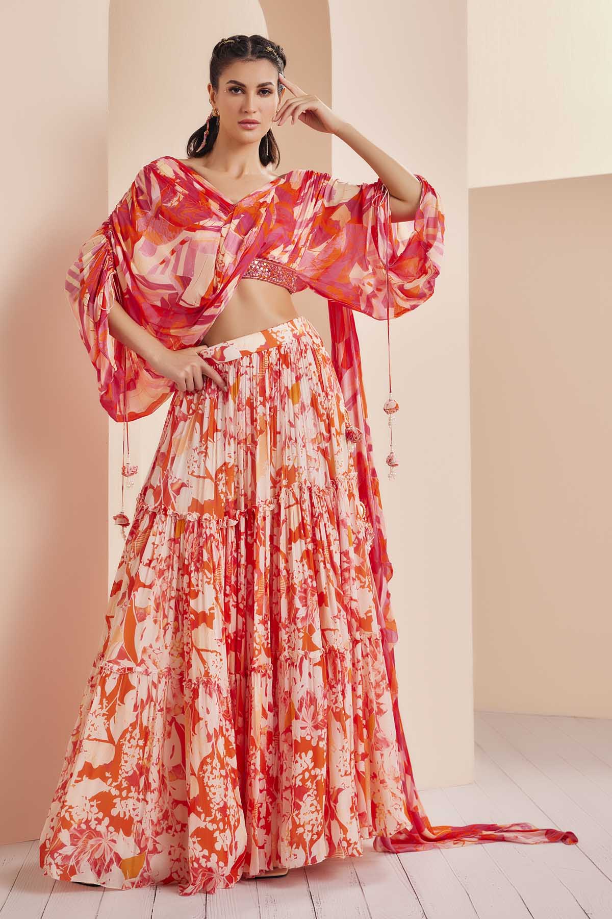 Buy Red Chiffon Printed Tiered Lehenga Set by Mandira Wirk